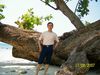 Behind_big_tree_on_Sebuku_Island_beach.jpg